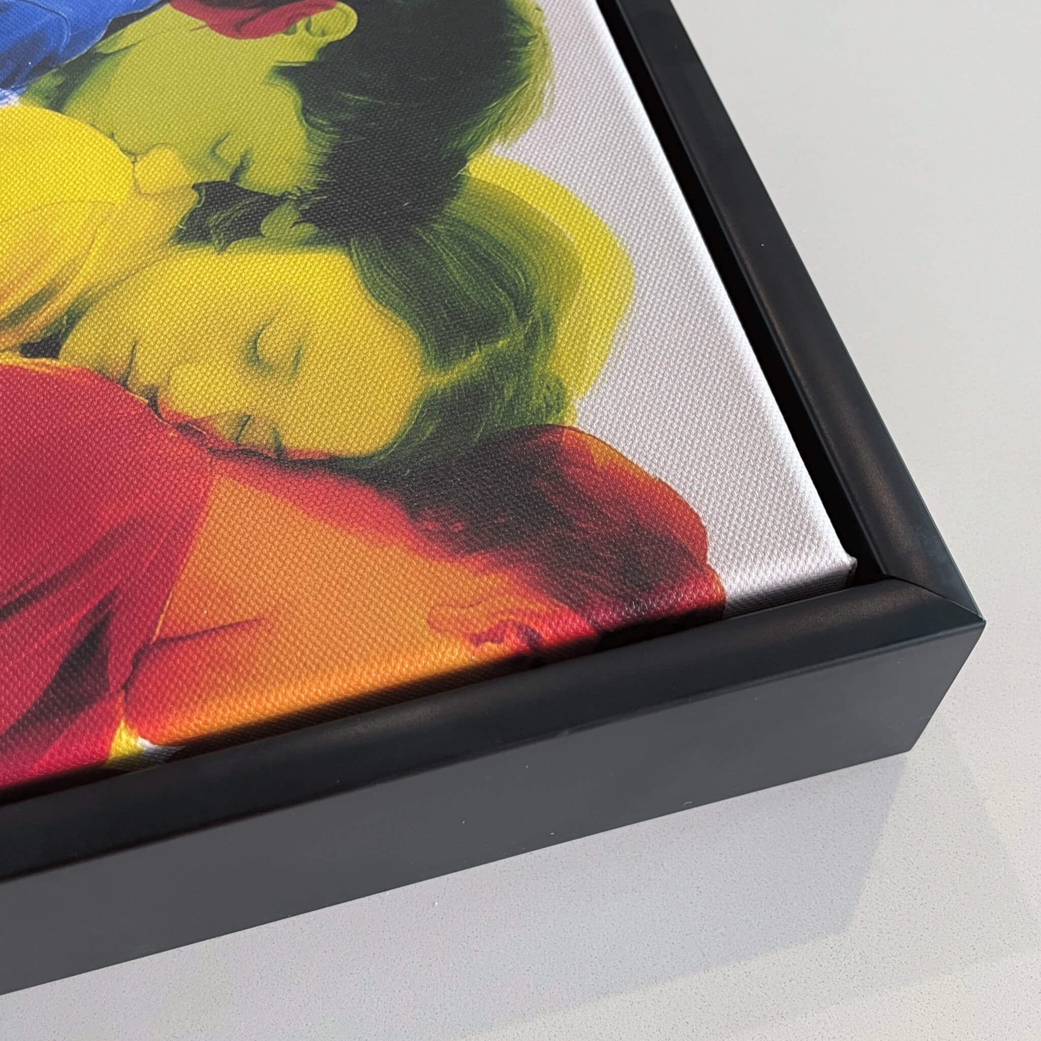 Framed artwork of a colorful abstract figurative design on a white background