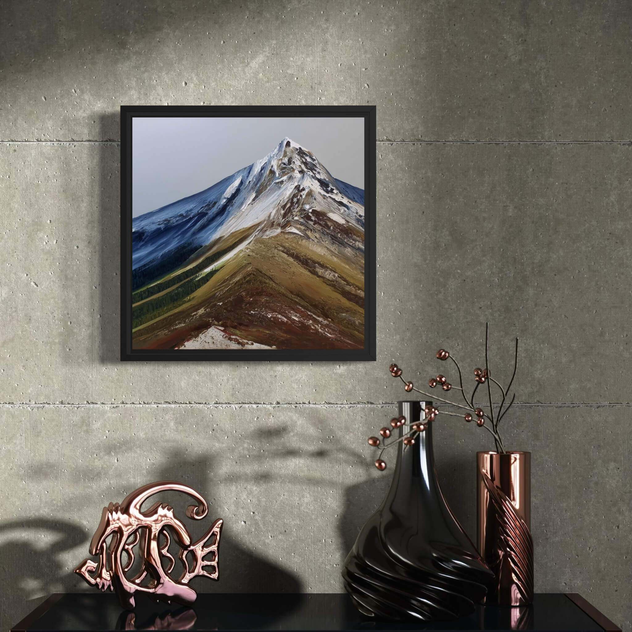Framed mountain painting on a textured wall with decorative vases and sculpture below.
