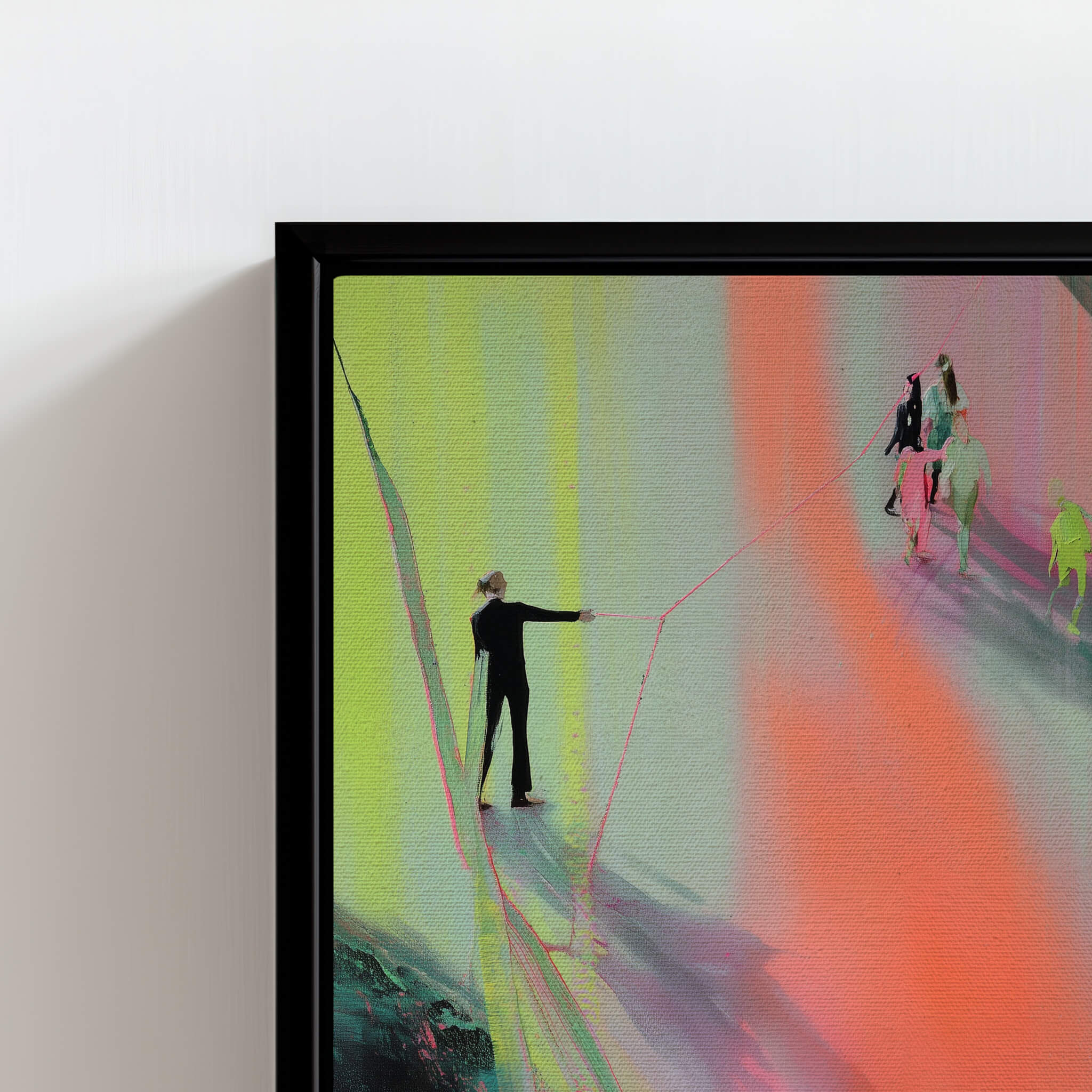 Framed abstract artwork with colorful lines and figures on a white wall