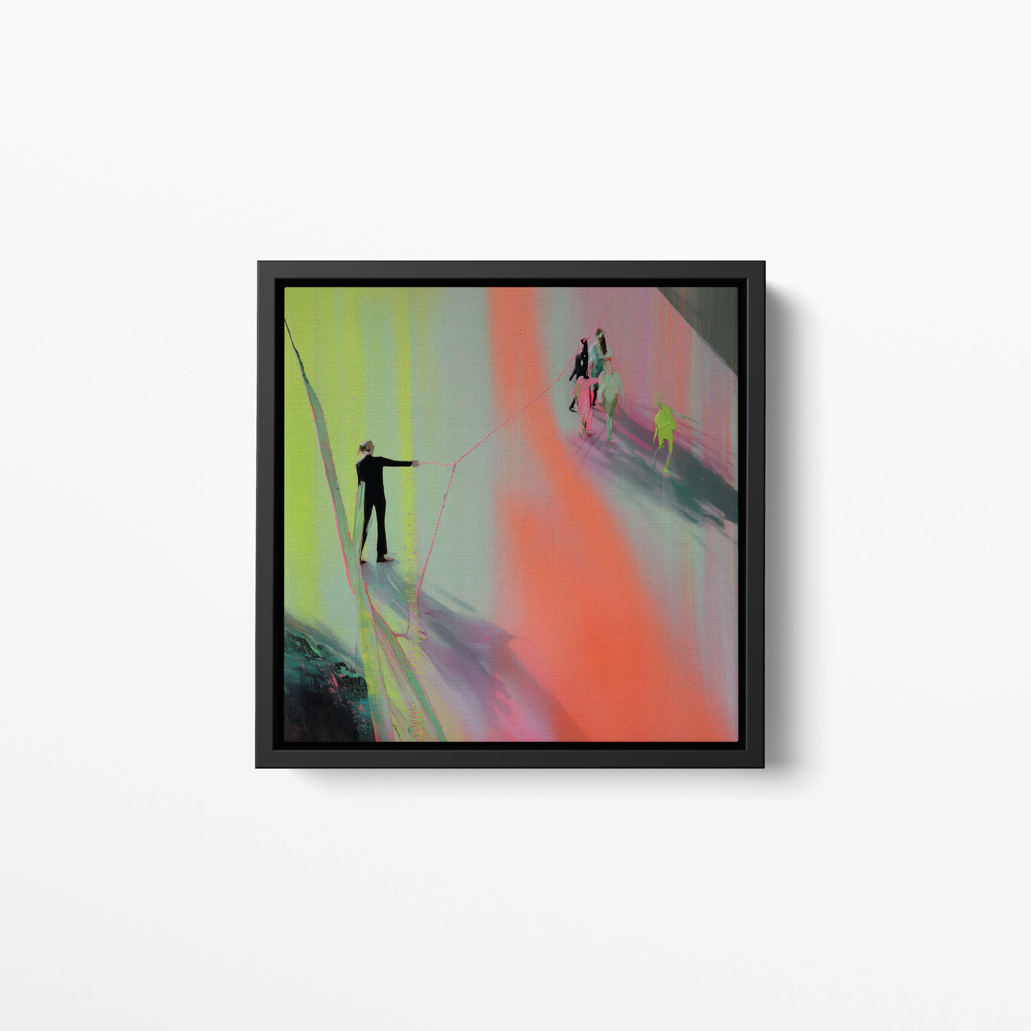 Framed abstract artwork with colorful brushstrokes on a white wall